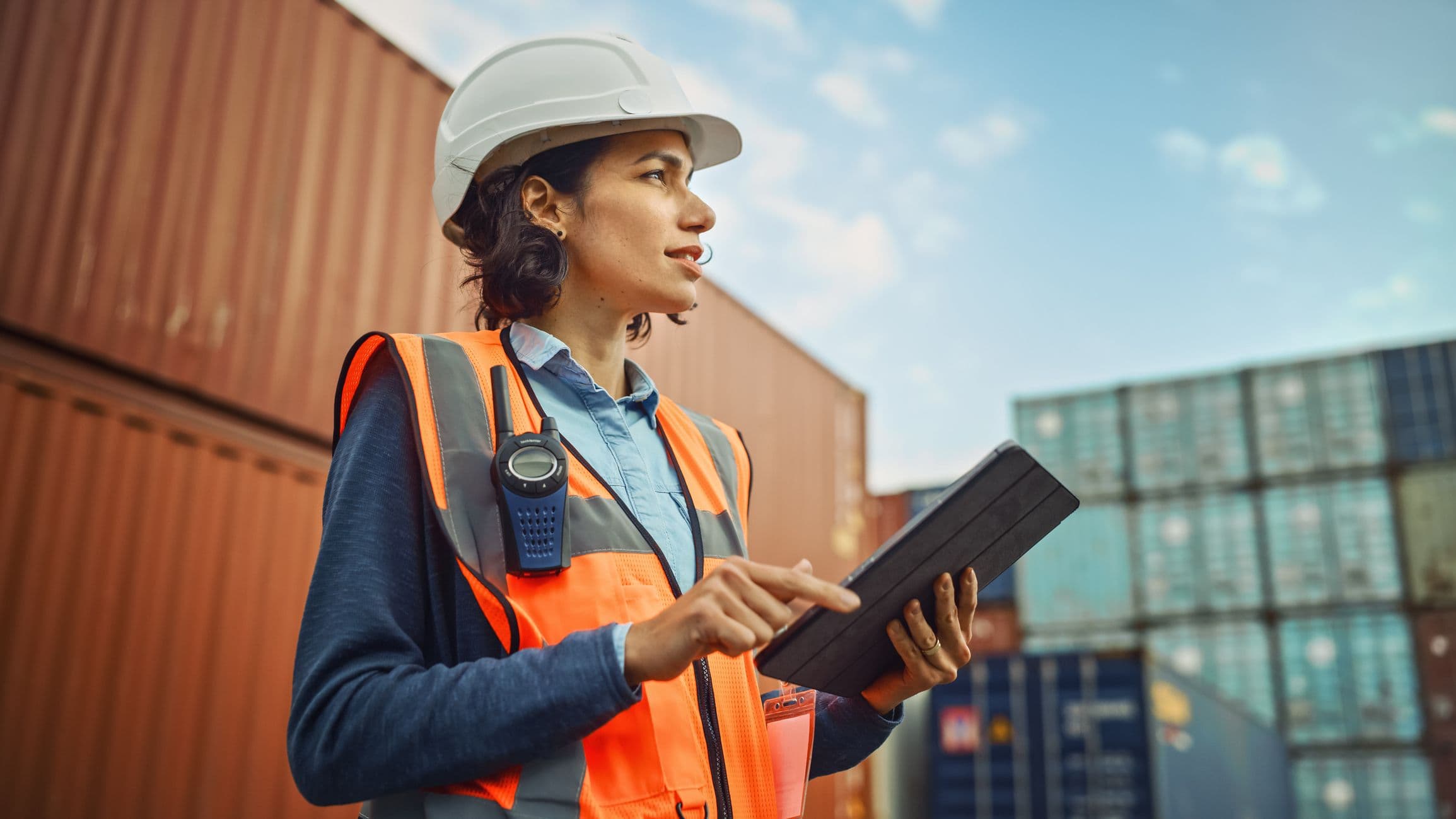 Building Worker Pointing at Construction Crane